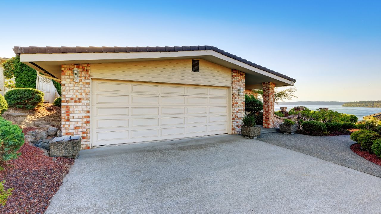 A close-up image of a concrete driveway stained with oil.